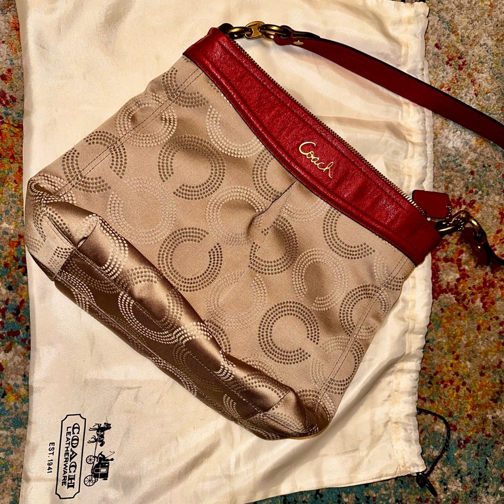 Coach Ashley dotted crossbody still has silk dust bag.